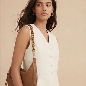 Anthropologie Urban Oroginals tan half moon hobo bag